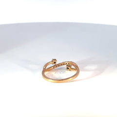 Anillo oro rosado con esmeraldas y diamantes estilo cruzado especial