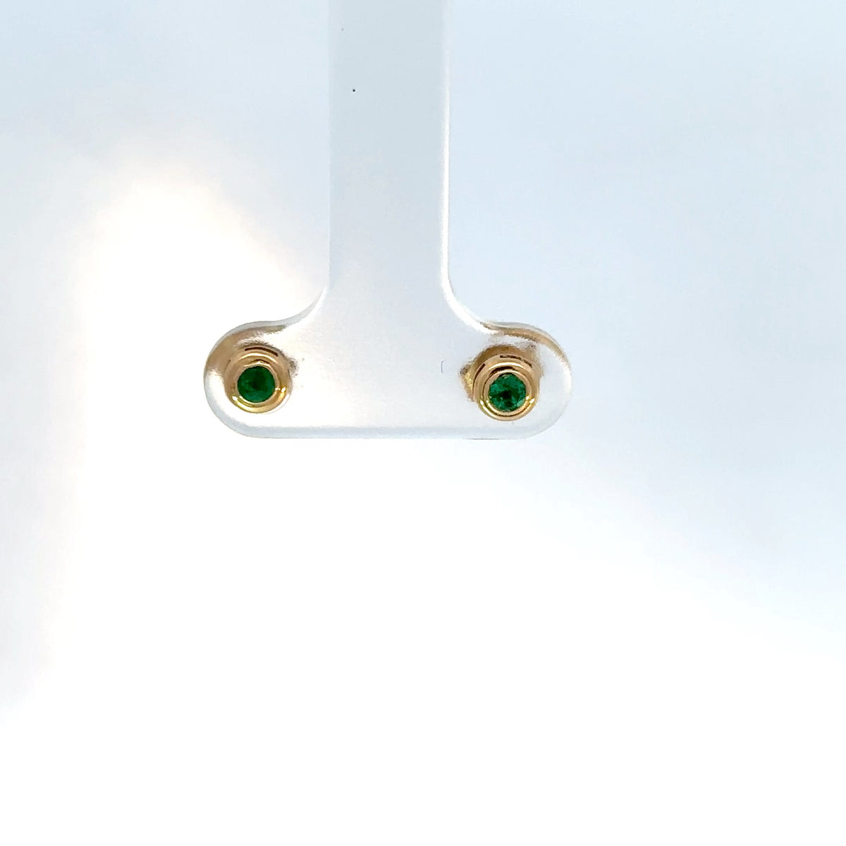 Topos oro rosado esmeralda bisel