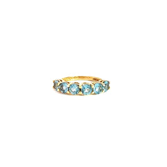 Anillo tipo cintillo con Topacios swiss blue